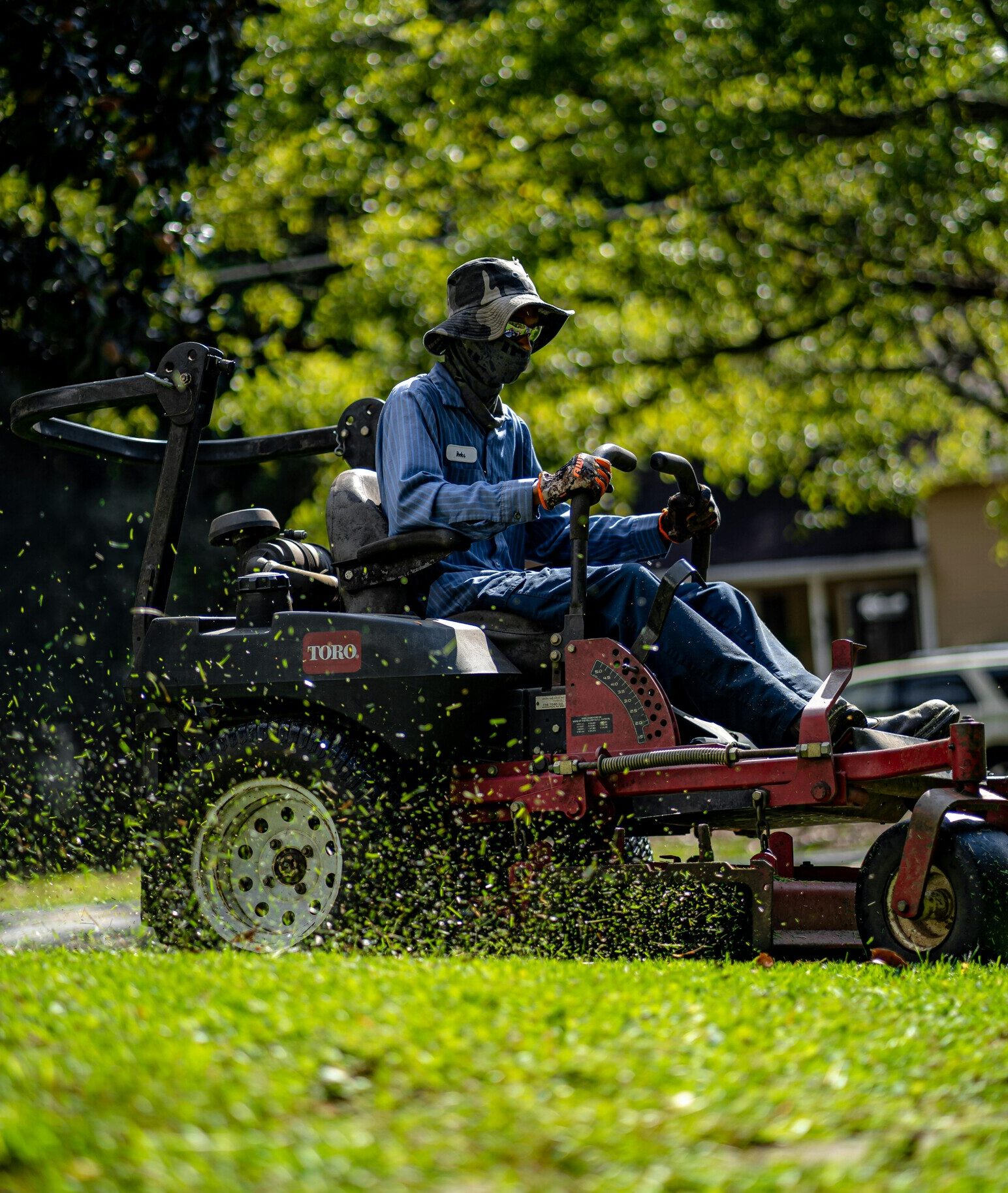 Commercial lawn maintenance with riding mower maintaining turf at a managed commercial property